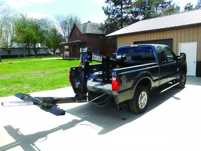 Hide-A-Lift Cobra wheel lift on a pickup truck